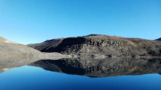 Cinder Cone and its reflections in the mud lake