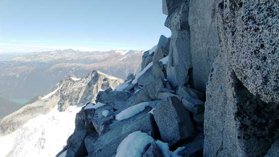 Traverse on a ledge, climber's left onto the N. Face