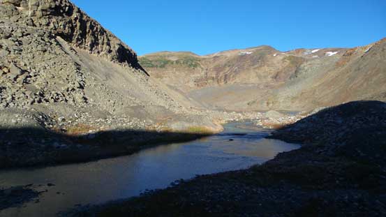 The stream flowing out of the mud lake