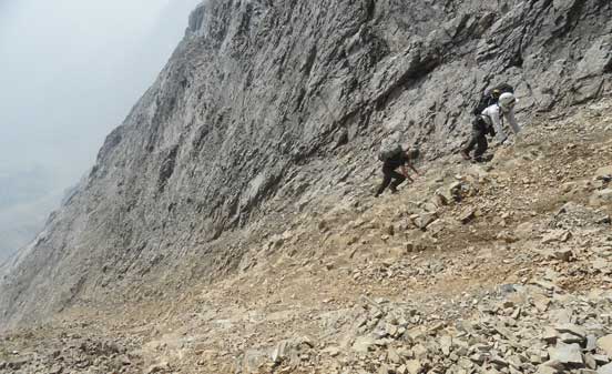 Robb and I climbing up the choss. Photo by Maury
