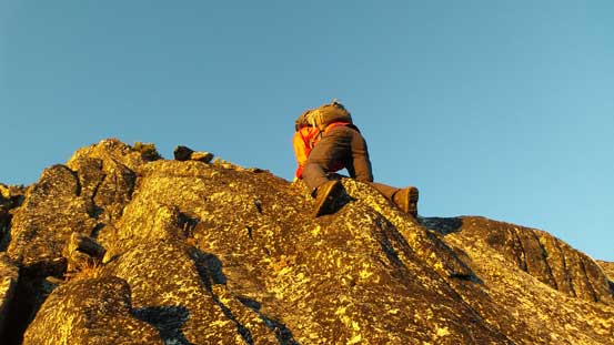 Ben down-climbing the tricky cliff band