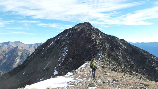 Alex traversing towards the true summit