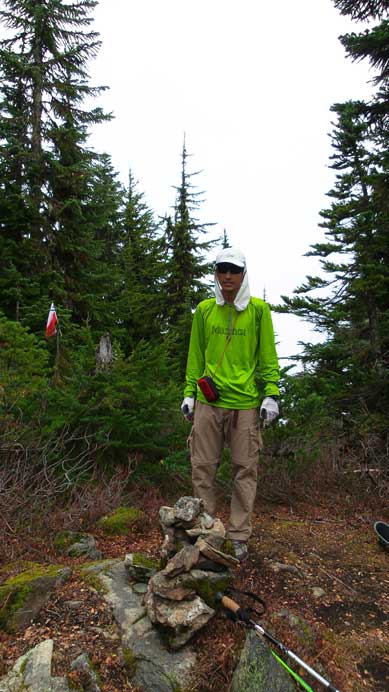 Me on the forested summit of Mt. Thurston