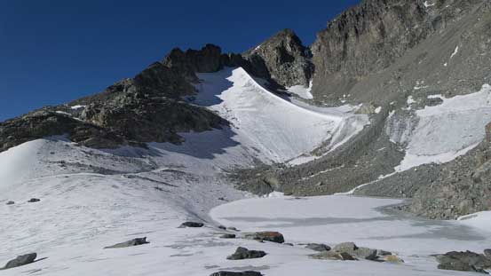 A frozen tarn by the upper basin. Note the ice arete behind