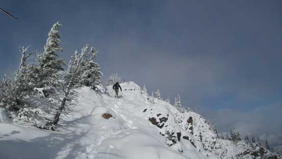 The terrain opens up towards the false summit