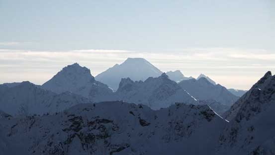 The volcano Mt. Baker with American and Canadian Border Peaks in front