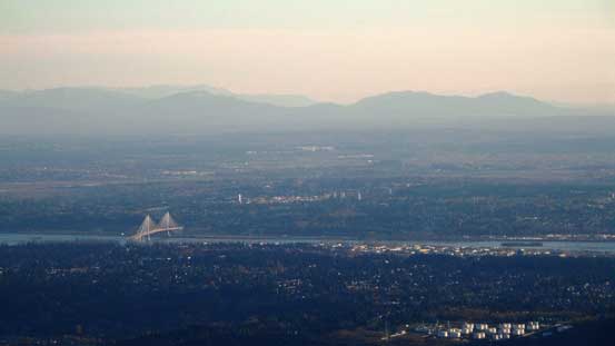 The bridge on bottom left is Port Mann Bridge (It charges you 3 bucks each time you pass it)...
