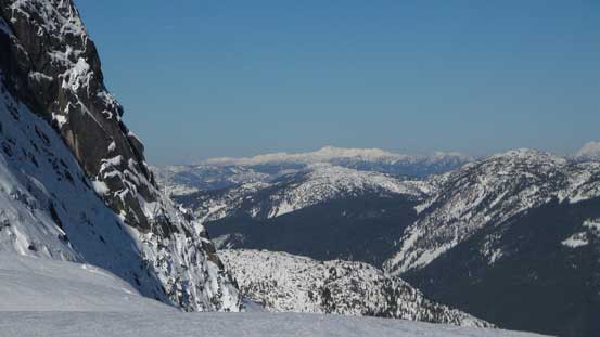Looking across the very steep NE Face towards some distant peaks