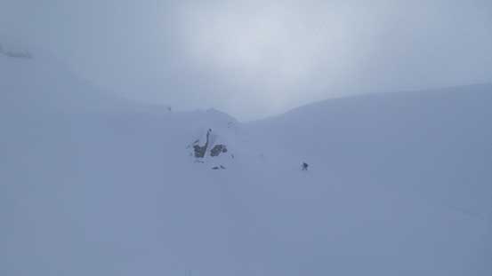 Alex skinning up the steep gully