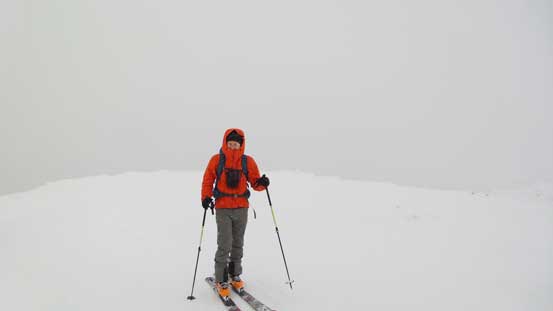 Ben approaching the summit of White Lupine Ridge. Not the greatest weather...