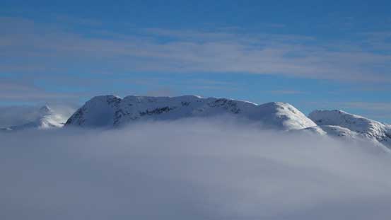 Long Peak poking through the low clouds - our first objective in this trip