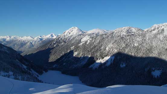Prior Peaks rise behind the frozen Lizzie Lake