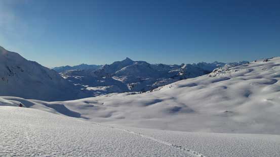 Skiing into this broad valley. Cloudraker Mountain behind