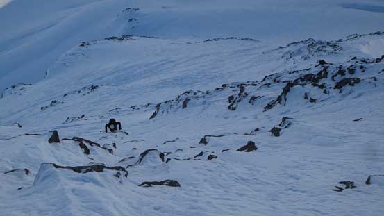 Alex down-climbing the face