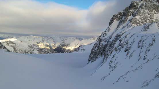 I'd descend in this depression zone to Aussie's entrance