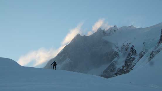 Alex ascending towards Warren Glacier with the massive peak in the background