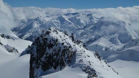 Looking over another pinnacle towards Spire Peaks by Mamquam Icefield