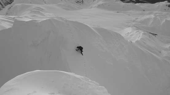 Here's Alex down-climbing into the notch separating the false summit with the true summit