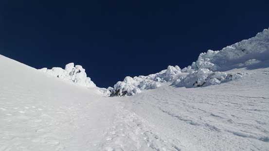 Partway down the lower face, looking back