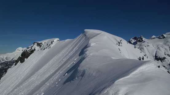The final summit ridge traverse. Note the cornices