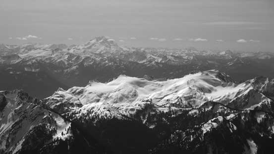 The volcano Glacier Peak rises behind Bacon Peak
