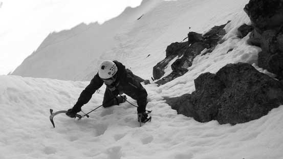 Alex ascending through the crux, and then up the steep channel
