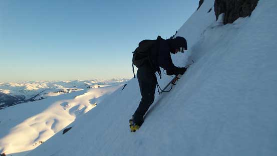 Alex down-climbing/traversing the upper west face