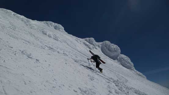 The same snowboarder going up