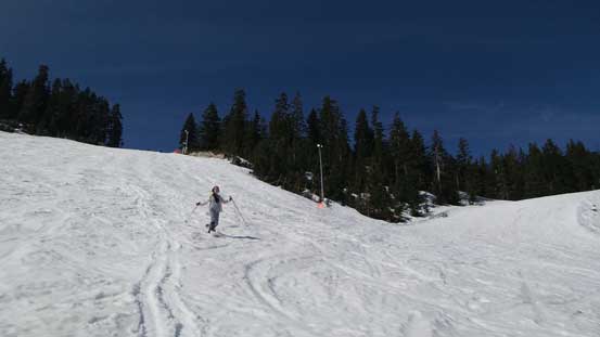 Having lots of fun plunging down the slushy snow