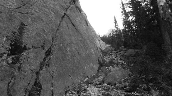 Here the trail parallels that slab wall for a long while