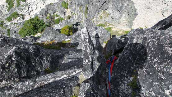 Down-climbing the initial steep stuffs to get into a "saddle". Note the tats