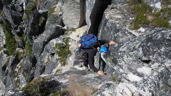 The other climber down-climbing the crux