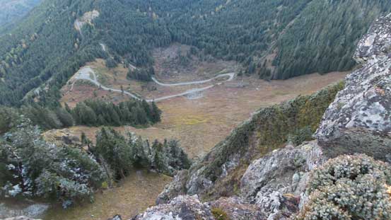 Looking steeply down the west face towards the winding road and the parking lot.