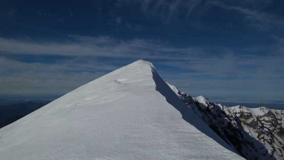 Cresting the crater rim, now looking at the first false summit.