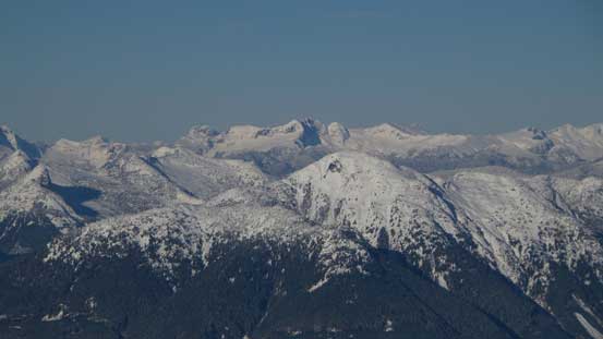 Looking over the summit of Mt. Wrottesley towards some distant giants by Sunshine Coast